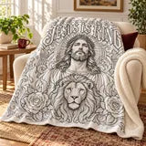 Jesus Is King blanket in a cozy reading corner